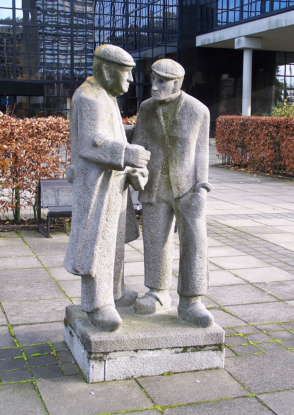 Handjeklappende kooplieden